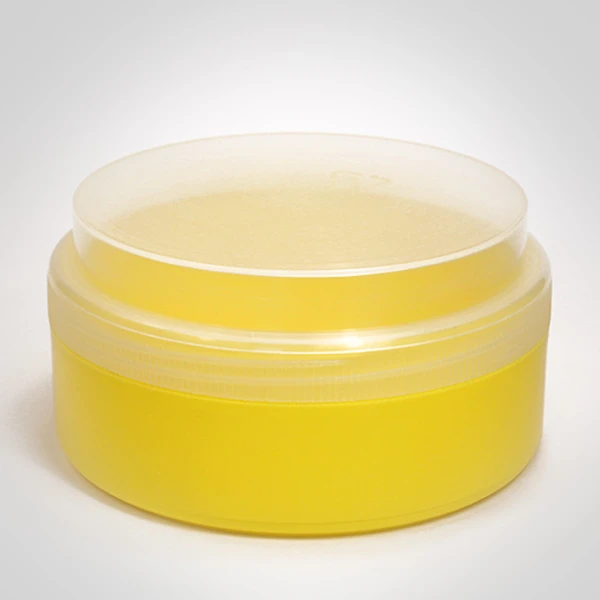 Gelbe Kunststoffdose mit transparentem Schraubdeckel